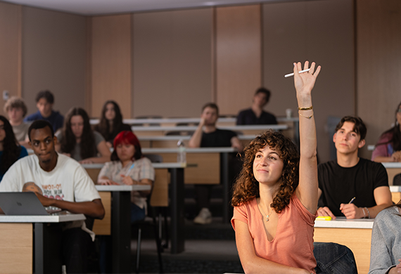 image of student raising her hand